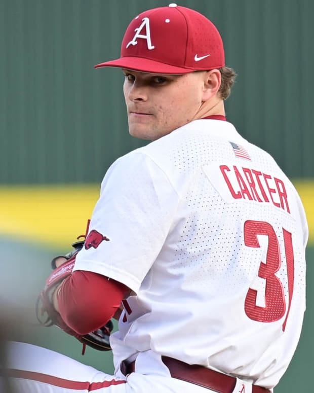 Razorbacks relief pitcher Dylan Carter delivering a pitch against Louisiana Tech on Friday afternoon.